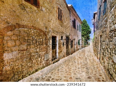 Vintage style picture of a medieval street in an old Tuscan village (toned image with grunge effect)