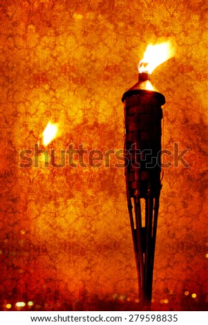 Vintage textured picture of glowing torch head against with reflection of light (texture added, grunge effect image, toned red, retro styled)