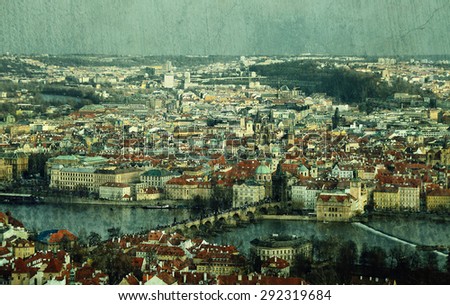Vintage textured postcard with above view of Old City of Prague with Charles Bridge (texture added, teal tinted)