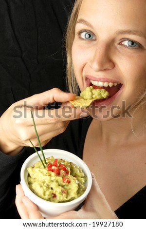 young woman eating tacos