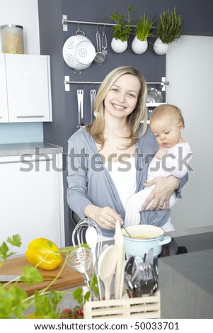 a young mother cooks with her daughter