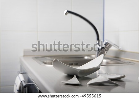 Dish Washing with Broken Plate. Focus on plate