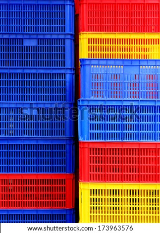 Plastic boxes in three primary colours.