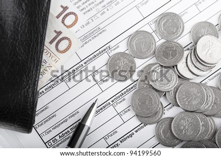 Business documents, wallet with polish paper money, one zloty coins and pen. Money and savings concept.