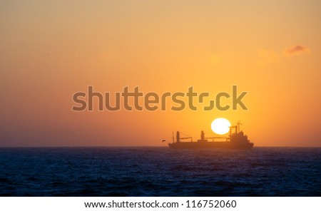 Ship, sea, sunset.