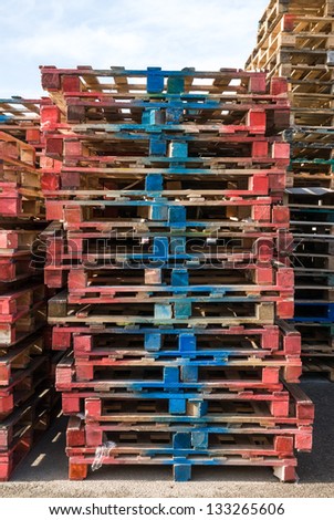 Pallets stacked on the outside of a factory