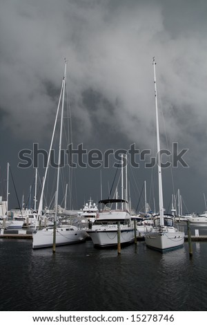 Nasty storm rolling in at a marina giving a dramatic, ominous  feel