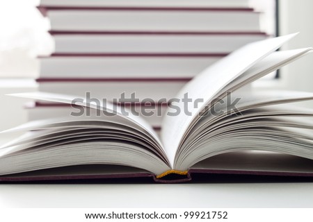 Some books and the opened book