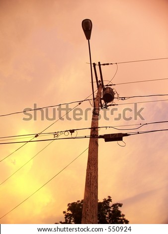 A street pole at sunset.