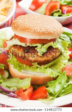 Healthy vegetarian soy burger with lettuce and tomato
