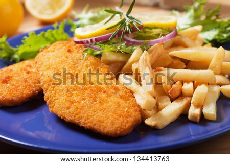 Fish and chips, breaded fish steak with french fries