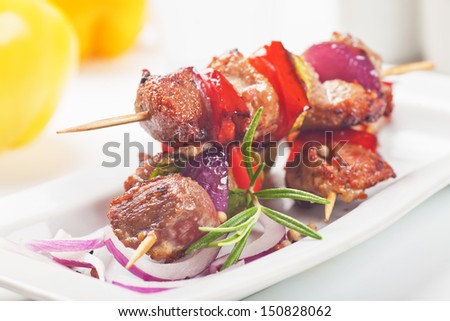Grilled meat and vegetable kebab on skewer