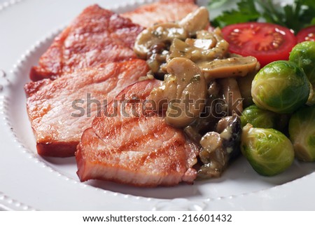Grilled ham slices with portabello mushroom sauce