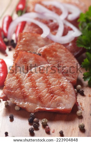 Grilled ham slices with peppers and onion