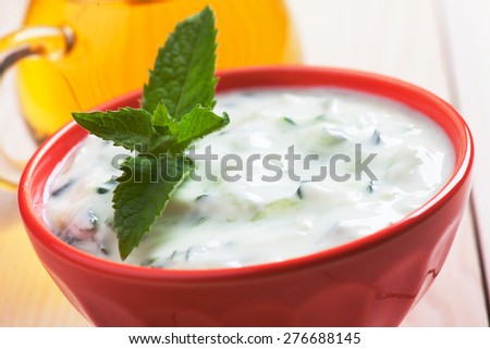 Tzatziki or cacik, cucumber and yogurt salad with mint leaves