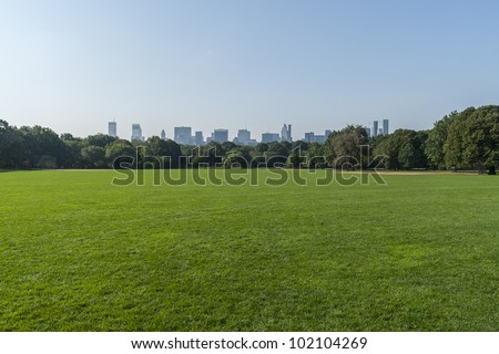 Panorama View Of New York City Central Park With Manhattan Skyline.