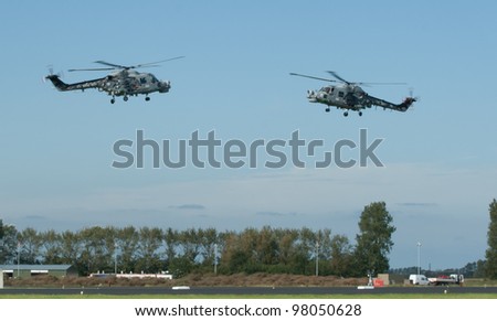 LEEUWARDEN,FRIESLAND,HOLLAND-SEPTEMBER 17: Royal Navy Helicopter Display Team \'Black Cats\' hovering at the Luchtmachtdagen Airshow on September 17, 2011 at Leeuwarden Airfield,Friesland,Holland