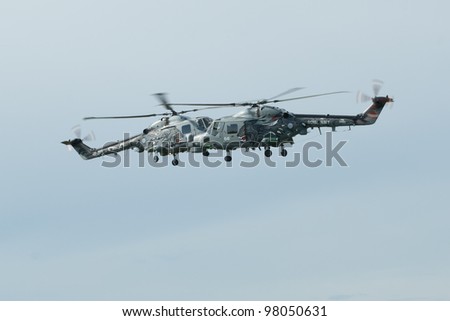 LEEUWARDEN,FRIESLAND,HOLLAND-SEPTEMBER 17: Royal Navy Helicopter Display Team \'Black Cats\'  hovering at the Luchtmachtdagen Airshow on September 17, 2011 at Leeuwarden Airfield,Friesland,Holland