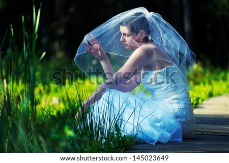 Sitting bride in the wood