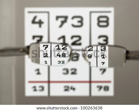 Eye test chart with eyeglasses