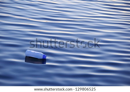 Plastic bottle floating on surface of water