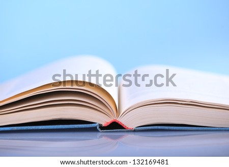 Open book on blue background