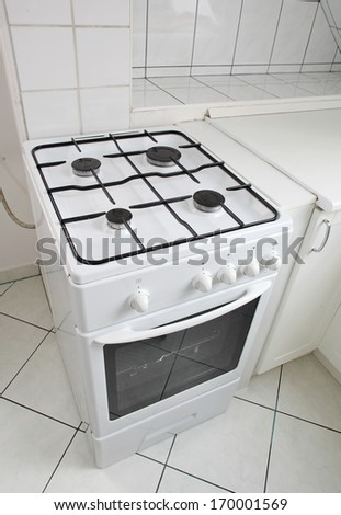 White Gas Cooker In White Tiled Kitchen