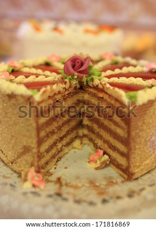 Decorated chocolate layers cake on table