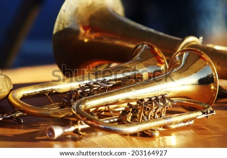 Blowing brass wind instrument on table