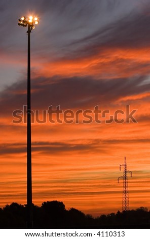 Symbol of electricity in sunset