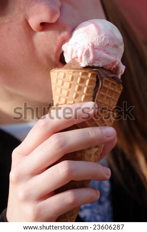 Young woman eat ice-cream outdoor,
