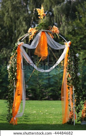 stock photo Decorated archway for wedding ceremony with colorful flowers 