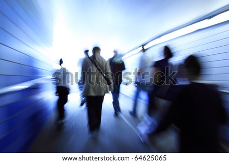 Crowd walking in a corridor