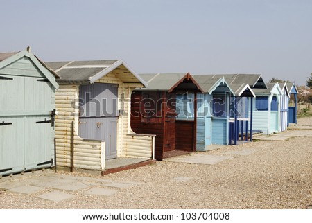Assorted beach huts at Ferring near Worthing. West Sussex. England. With shingle beach.