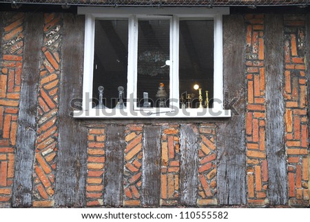 Window in brick and timbered wall of old house. Petworth. West Sussex. England