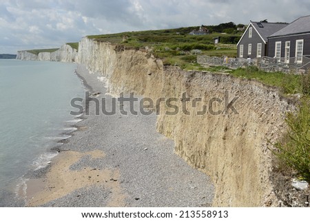 White Chalk Cliffs the Seven Sisters at Birling Gap near Eastbourne in East Sussex. England. With cafe on cliff top