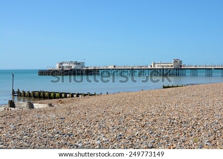 Pier, seafront and beach at Worthing, West Sussex, England.