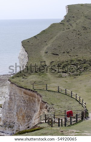Edge of chalk cliff, footpath and fencing at Hope Gap between Seaford and Eastbourne, East Sussex, England