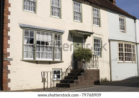 Terraced houses with painted brickwork in Arundel. West Sussex. England