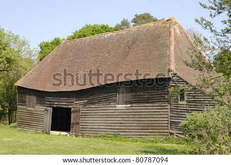 Old barn with timber walls and tiled roof. Wineham. West Sussex. England
