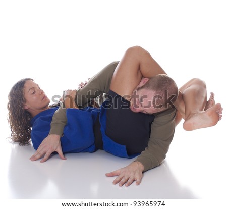 stock-photo-female-martial-artist-immobilizing-an-opponent-with-an-inverted-triangle-choke-93965974.jpg