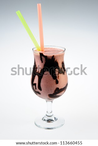 Cocktail with black chocolate over white background