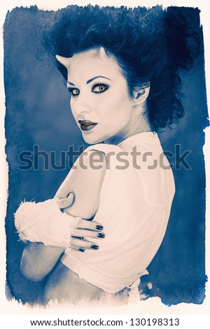 Portrait of beautiful horned woman with bright makeup, black and white photo