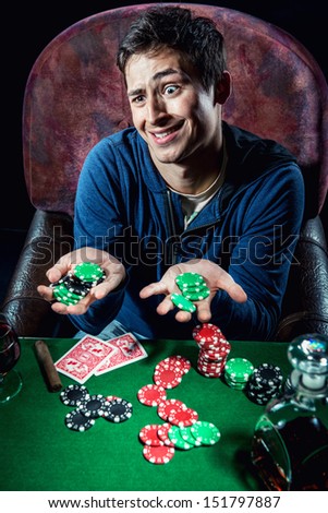 Poker player holding poker chips