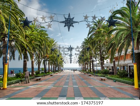 NERJA, SPAIN-DECEMBER 14, 2013: View of Balcon de Europa, spanish landmark in Nerja, Costa del Sol.  Its completely pedestrianised and it is lined with cafes and restaurants on december 14, 2013