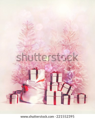 Christmas trees with heap of gift boxes