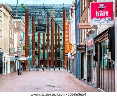 Eindhoven, Netherlands - May 24, 2015: People walking in the Eindhoven main commercial street. It is one of the most famous shopping street in the city with plenty of stores, bars and clubs
