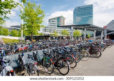 Eindhoven, Netherlands - May 24, 2015: Bicycle parking area in Eindhoven bus central station. Bicycles are popular way to get around for the Dutch