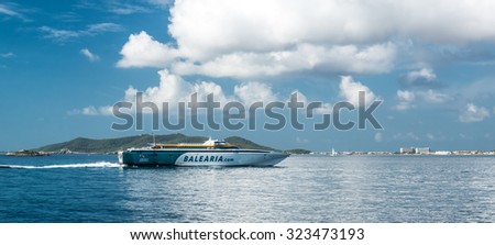 Ibiza, Spain- September 21, 2013: Fast ferry Balearia arriving to the Ibiza port. Balearia is the only ferry operator in Spain that connects the four Balearic Islands to mainland Spain