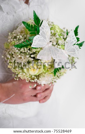 stock photo Beautiful bridal bouquet decorated with butterflies